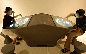 Figure 8: Visitors interacting with the offgallery "Dialog Table."